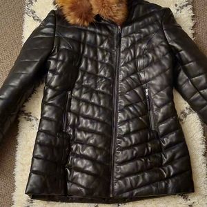 Black 3/4 length puffer leather coat.